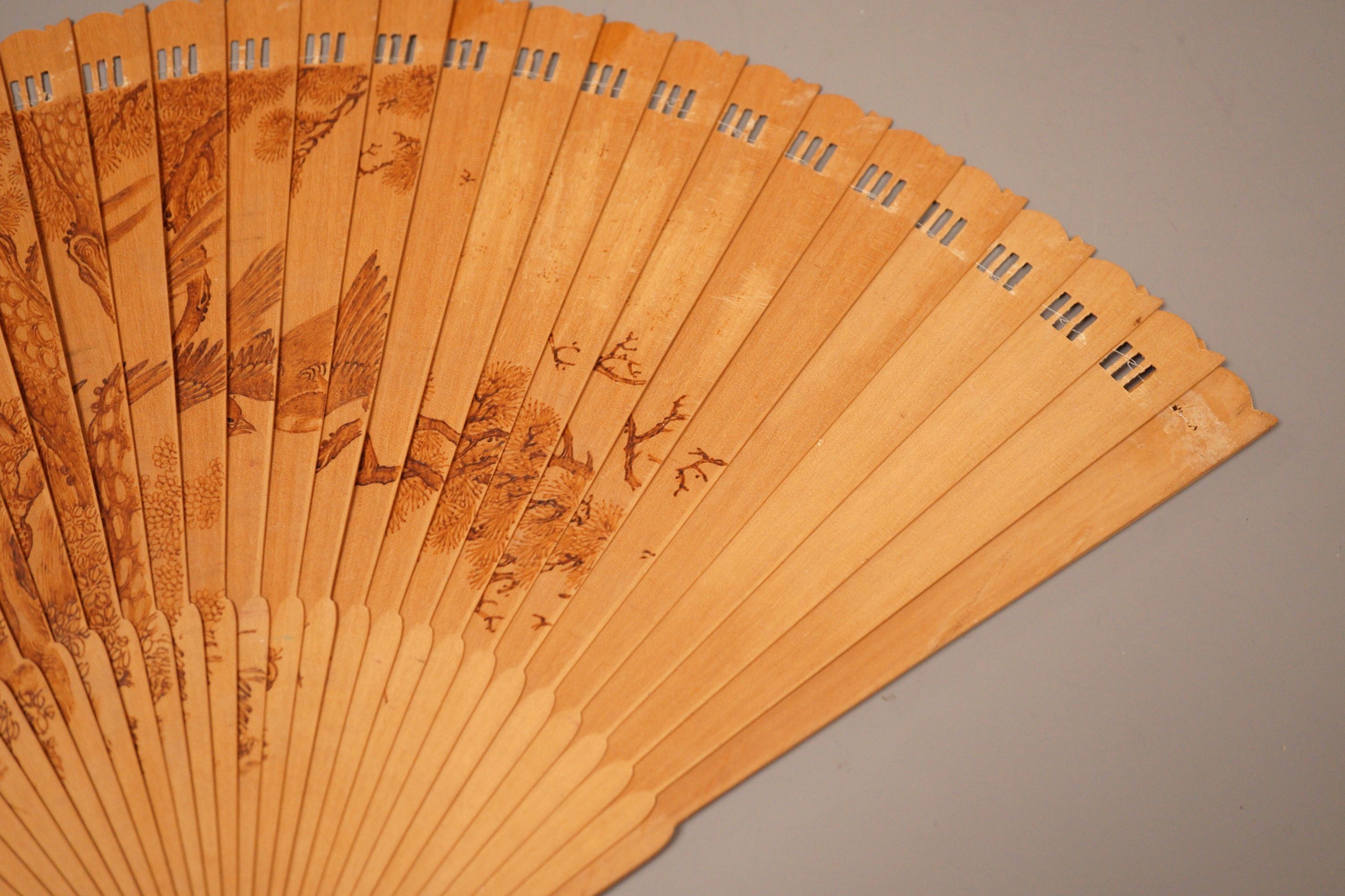 A Chinese penwork sandalwood fan